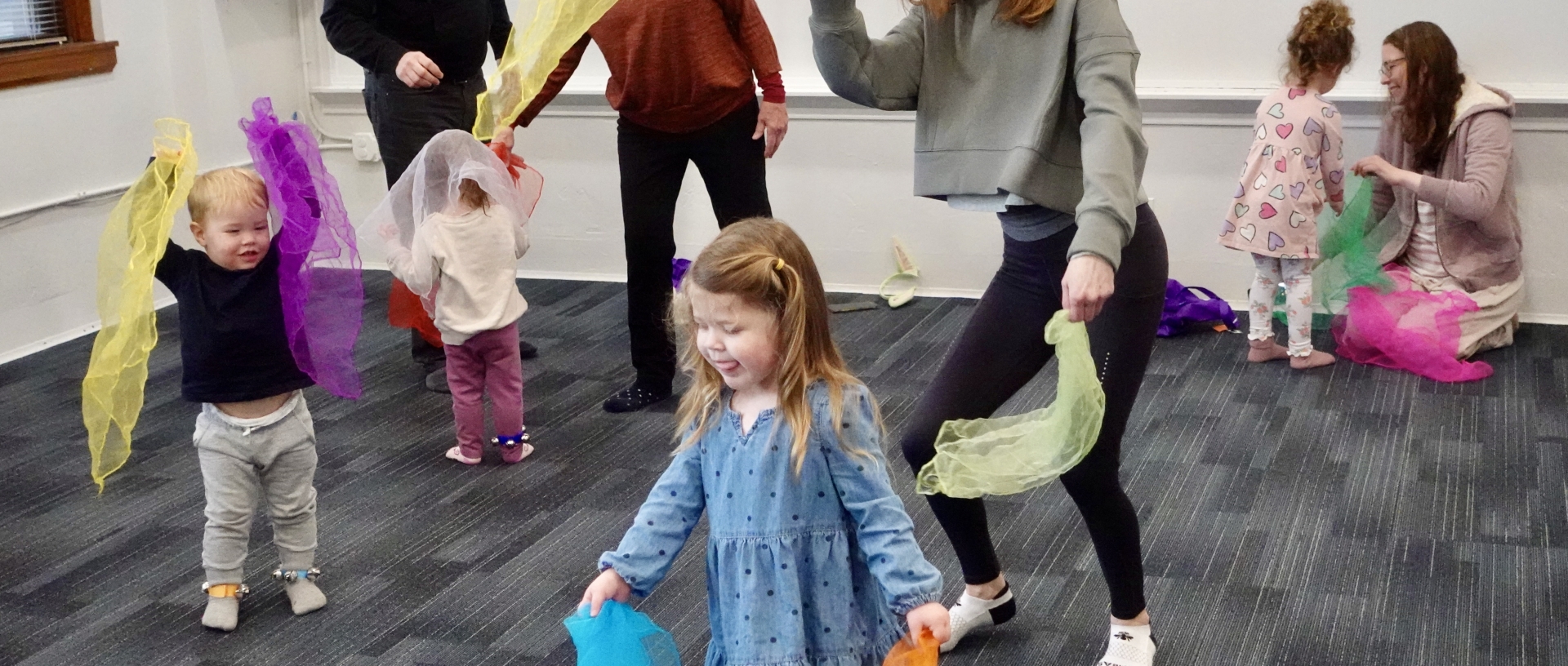 A young student waves scarves in The Music Class at Powers