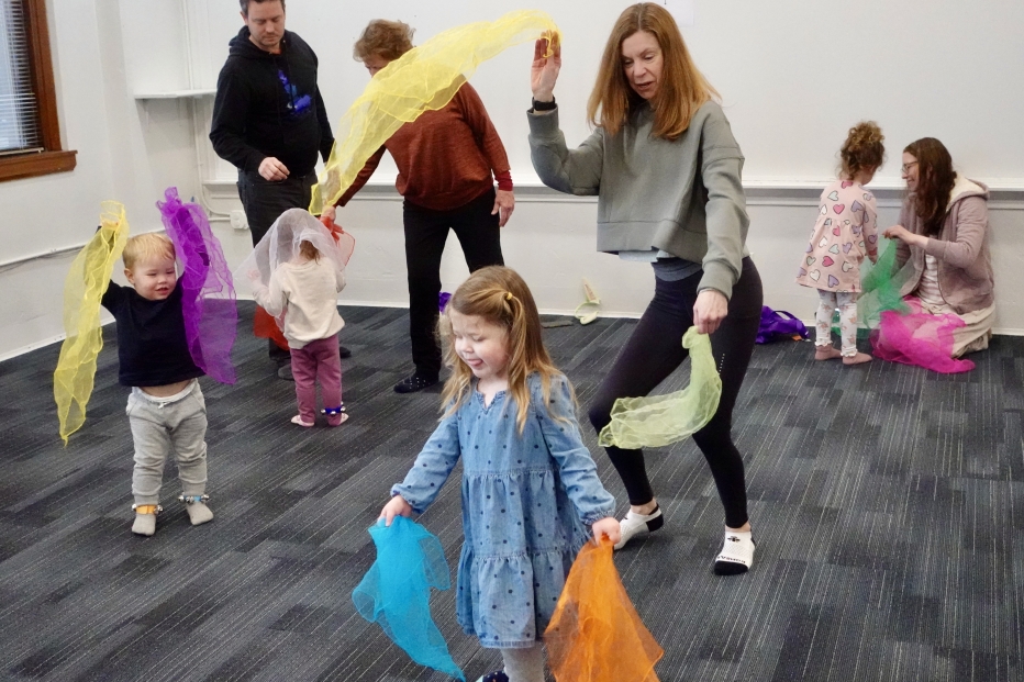 A young student waves scarves in The Music Class at Powers